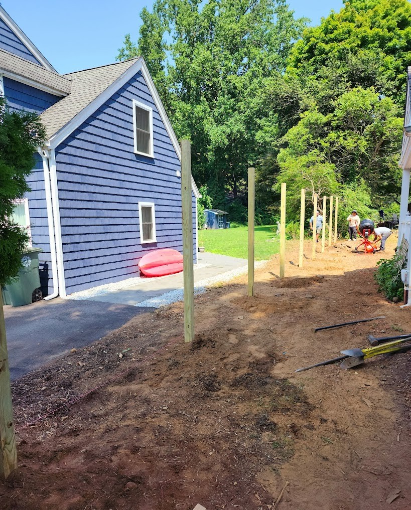 Old weathered wood fence before replacement